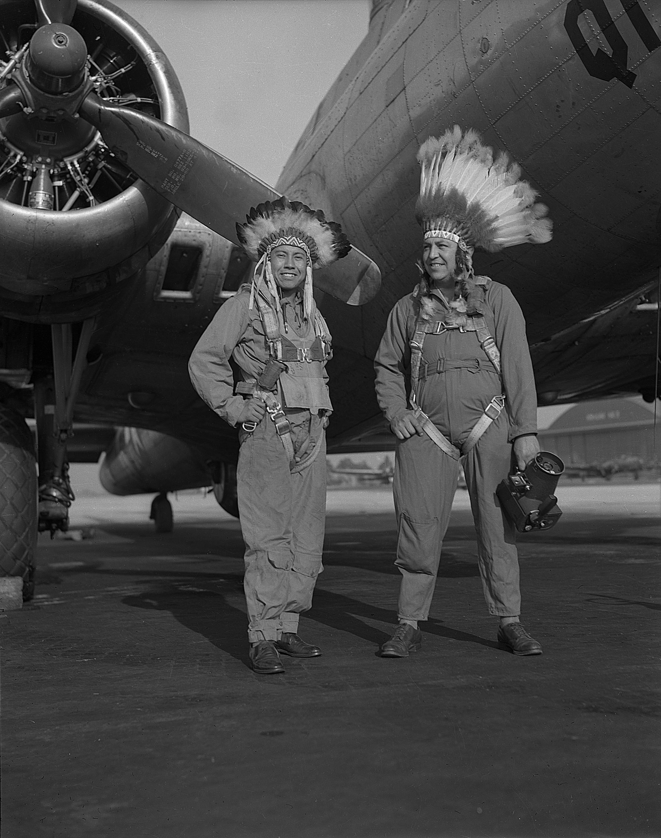 Caption: Gus Palmer (Kiowa, at left), side gunner, and Horace Photography: Horace Poolaw (Kiowa) in front of a B-17 Flying Fortress. MacDill Field, Tampa, Florida, ca. 1944. Courtesy Estate of Horace Poolaw.