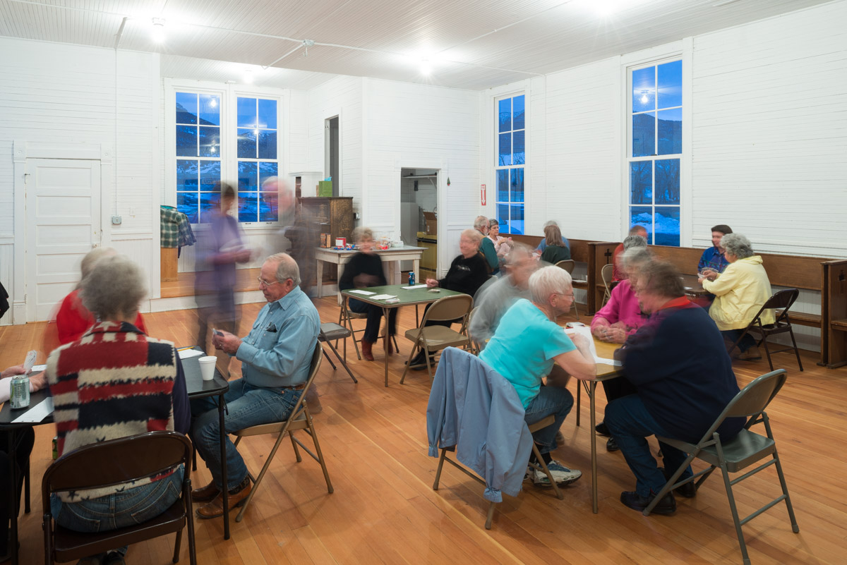 Perhaps 30 people show up for one of the Cabin Fever Pinochle Parties at the Bear Creek School House. Players change partners and tables throughout the evening.