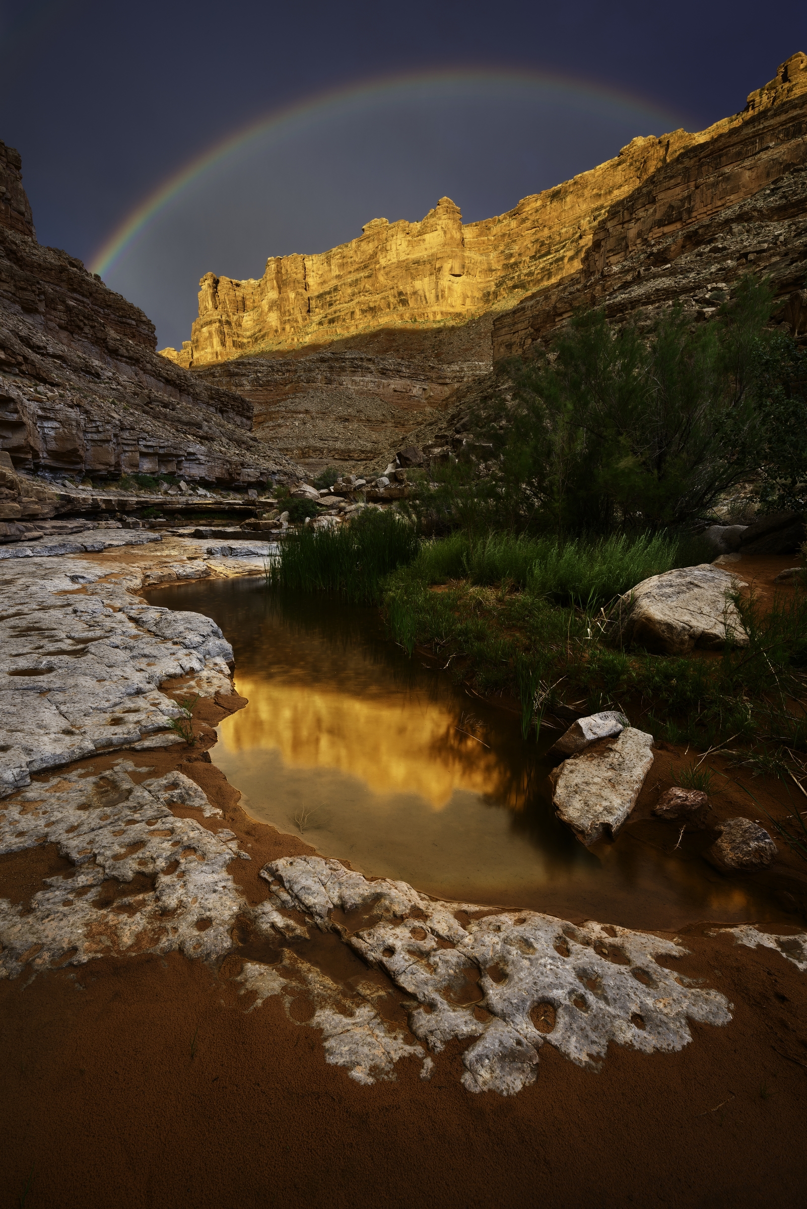 A Rainbow Over Slickhorn Canyon in Utah. Photography: Adam Schallau