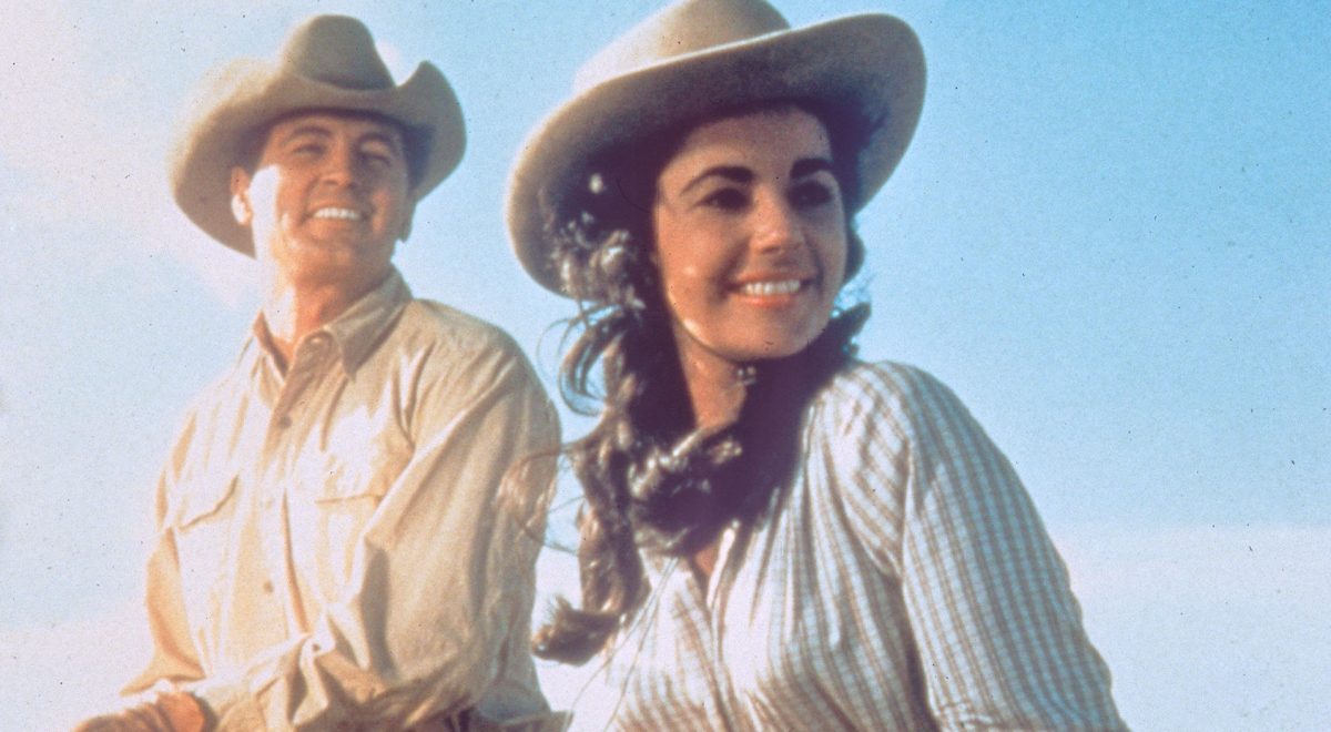 Actors Elizabeth Taylor and Rock Hudson smile while on horseback for the 1956 film "Giant."