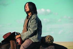 Aminah Nieves as Teonna in season 2, episode 7 of 1923 streaming on Paramount+. Photo credit: Lo Smith/Paramount+.