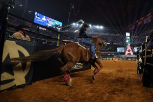 ARLINGTON, TEXAS - MARCH 09: Derrick Begay competes in the team roping event during The American Rodeo by Teton Ridge at Globe Life Field on March 09, 2024 in Arlington, Texas. (Photo by Carolyn Simancik/Getty Images for Teton Ridge)